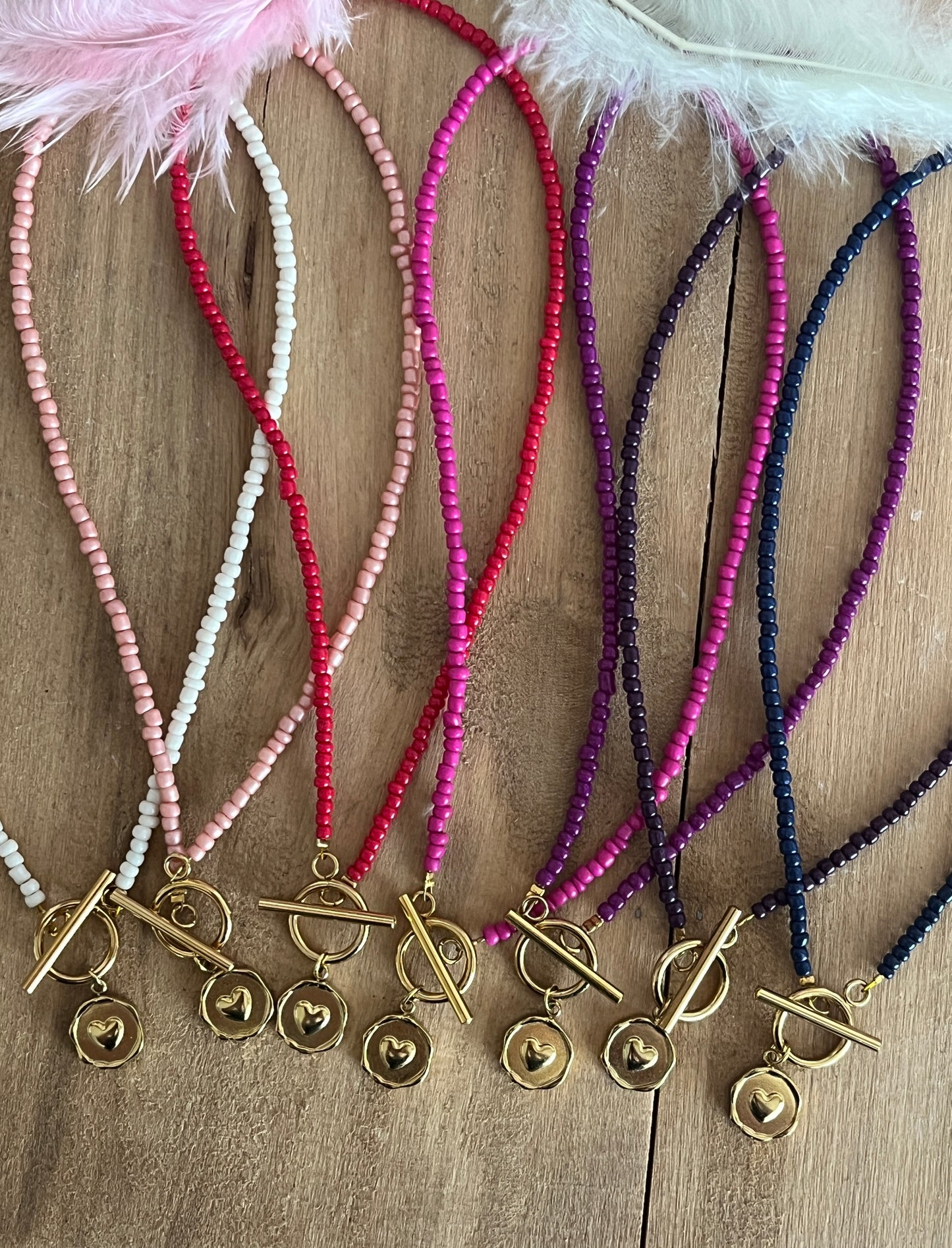 collier breloque coeur perles