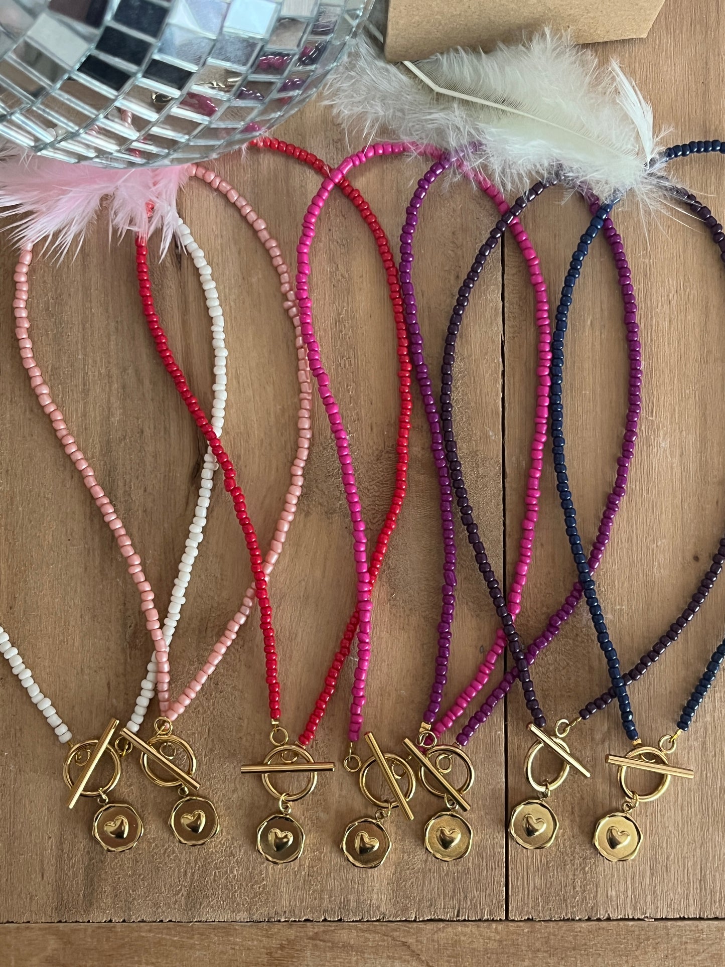 collier perles breloque coeur