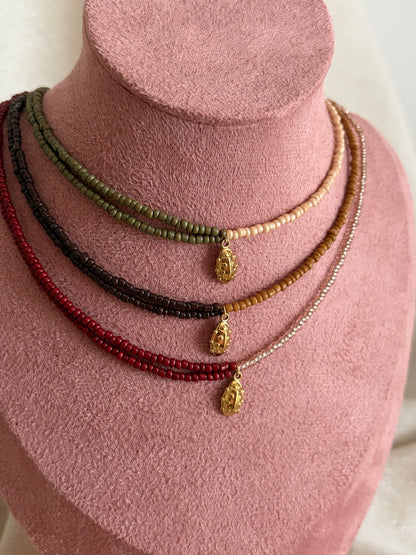 collier perles coccinelle 