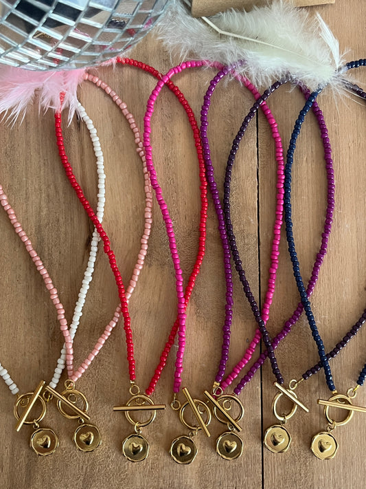 collier perles medaillon coeur