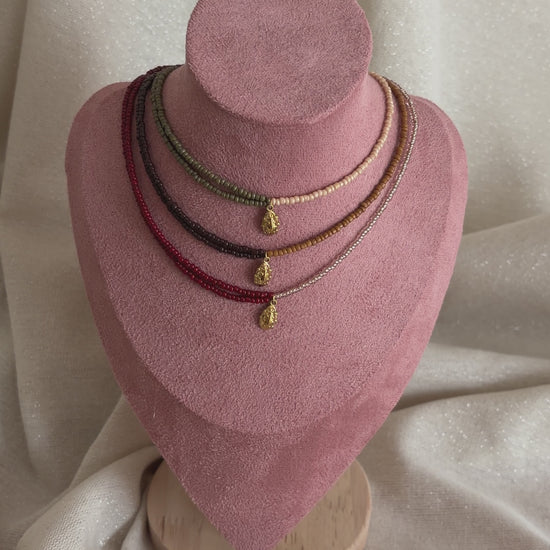 collier perles colorees coccinelle